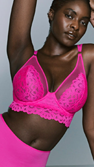 Ungefütterter Spitzen-Bügel-BH aus der PrimaDonna Twist Serie Dear Night in knalligem Pink mit transparenter Spitze und vielseitigen Multiway-Trägern.